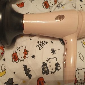Pink T3 hair dryer with diffuser. Barely used.